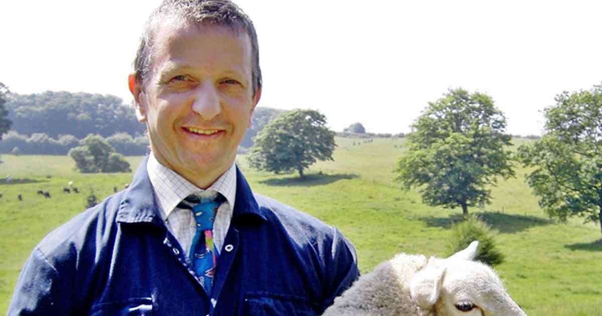 Julian Earl, carrying a 40kg lamb at home.