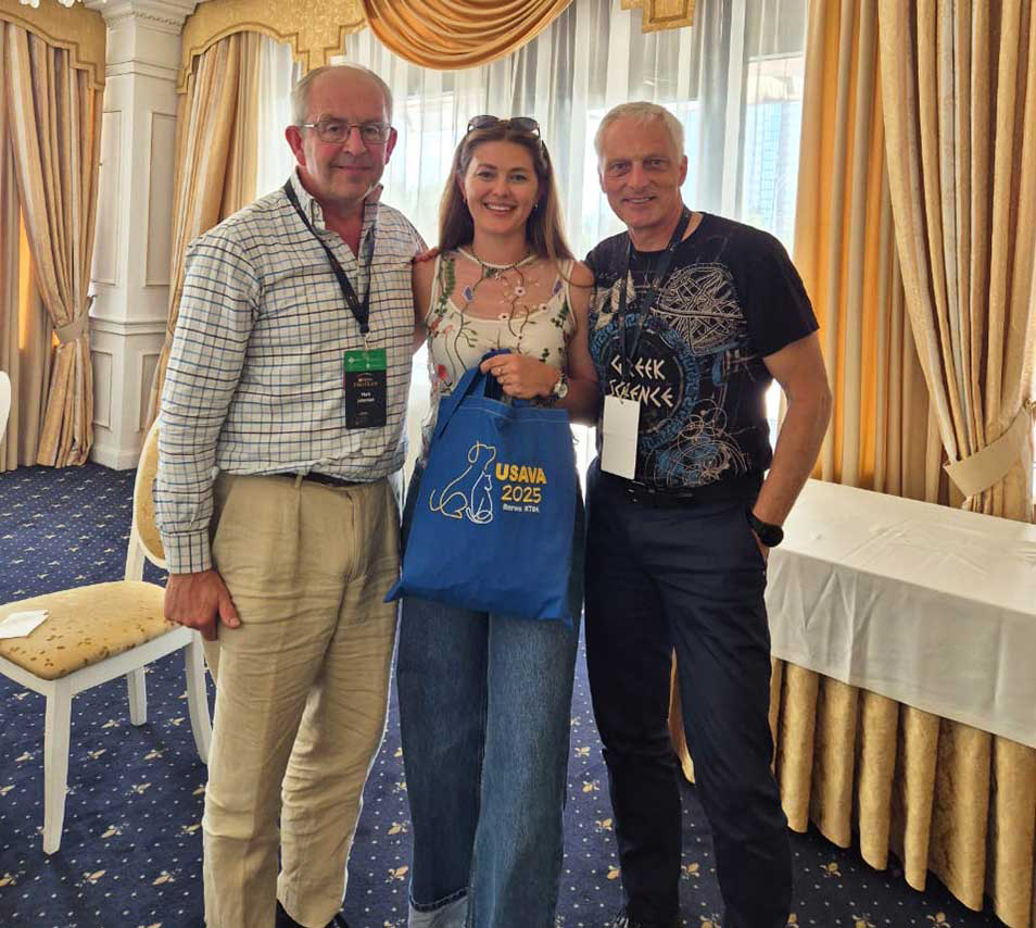 Three people attending a CPD event in Ukraine.