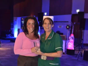 Image of Sophie Barnes receiving her SVN of the Year award from Emma Townson.