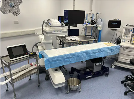 Figure 5. The typical theatre set-up for a urinary intervention, showing the laser, fluoroscopy and endoscopy.