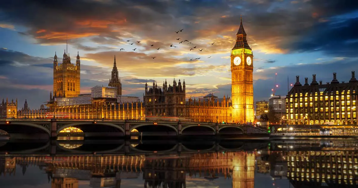 Government Houses of Parliament with Big Ben's clock tower in the foreground, taken at night from near the London Eye. Image: moofushi / Adobe Stock